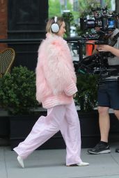 Suki Waterhouse Rocks Sonos Headphones and Pretty in Pink Attire on a Film Set in NYC 05-13-2024