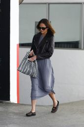 Chrissy Teigen in a Leather Jacket and Long Gray Dress in Beverly Hills 06-06-2024