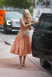 Devon Windsor in a Coral Dress by Alexis, a Colorful Handbag by Kurt Geiger and Aeyde Heels in Miami 06-15-2024