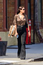 Irina Shayk in Black Flared Jeans and a Brown Shirt in New York 06-04-2024