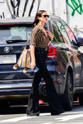 Irina Shayk in Black Flared Jeans and a Brown Shirt in New York 06-04-2024