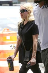 Madonna Wearing a Black Oversized T-shirt, Black Leggings and Black Combat Boots - NYC 06-29-2024