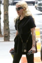 Madonna Wearing a Black Oversized T-shirt, Black Leggings and Black Combat Boots - NYC 06-29-2024