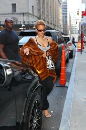 Rihanna Dazzles in NYC with Chic Curly Hair and Bold Fashion Statement
