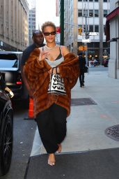 Rihanna Dazzles in NYC with Chic Curly Hair and Bold Fashion Statement