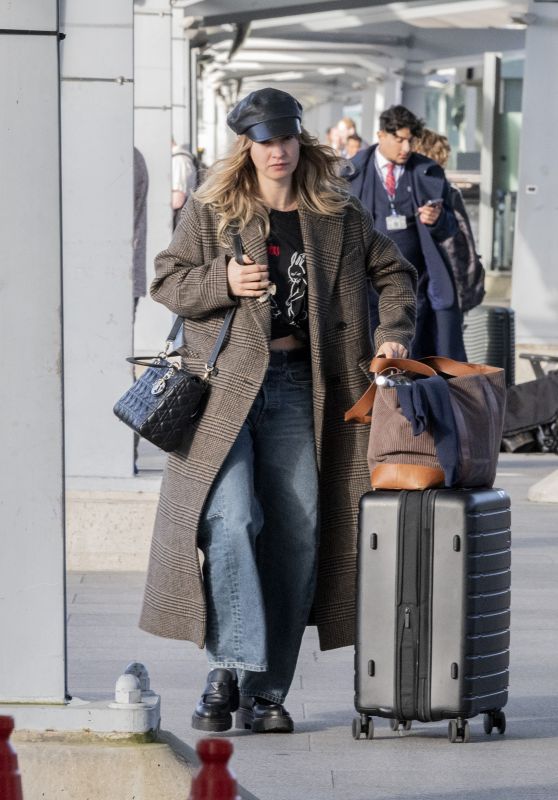 Lily James Goes Low Key at London Airport [10-23-2024]