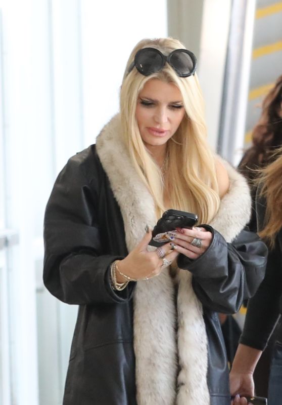 Jessica Simpson Rocks Designer Luggage and Chic Winter Look at LAX Amid Ring Drama