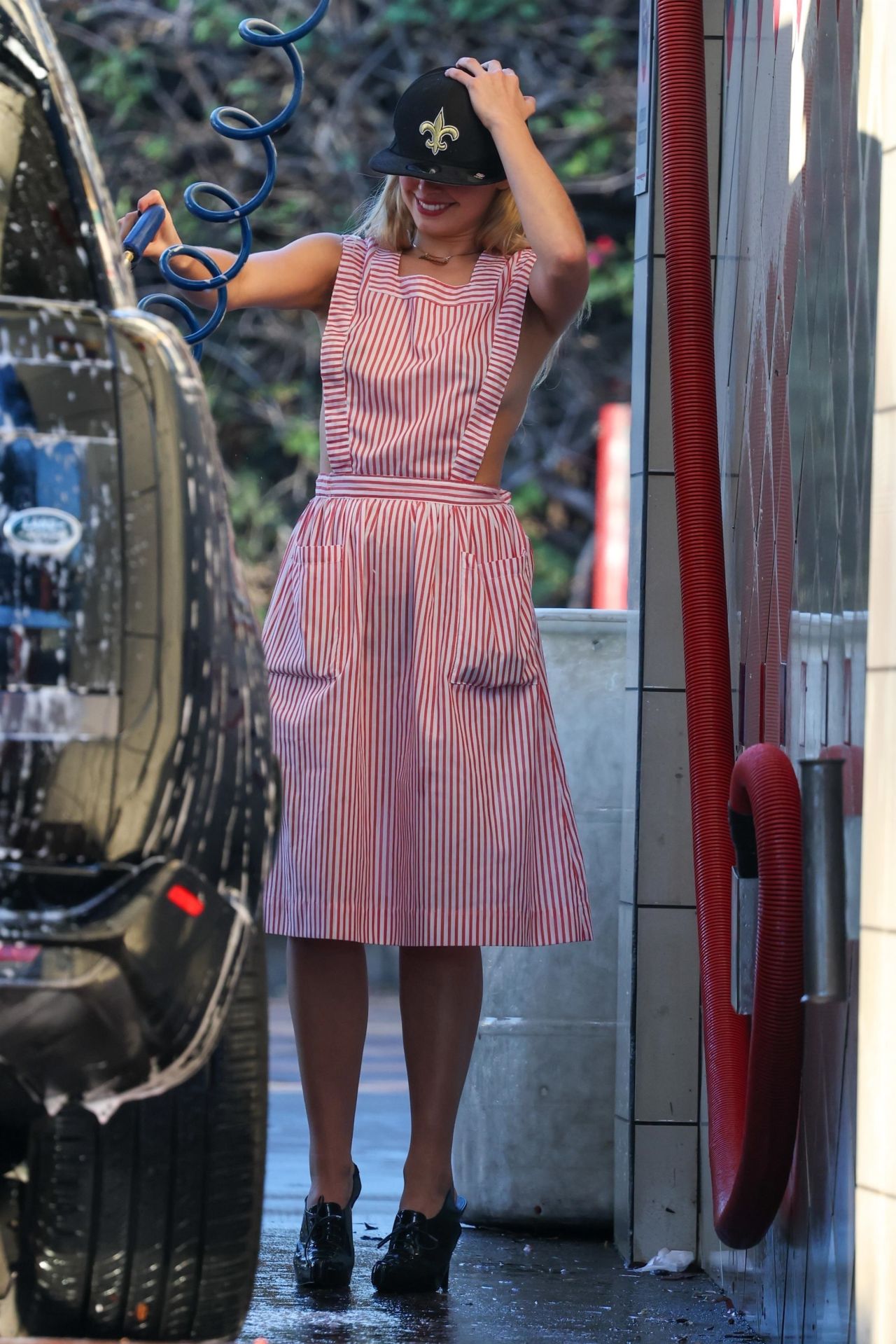 Addison Rae's Daring Car Wash Chic: Candy Striper Style Turns Heads ...