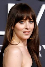 Dakota Johnson’s Gucci Gown Steals the Show at SNL 50