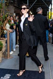 Anne Hathaway Teases Met Gala Look at Versace Party