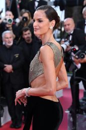 Izabel Goulart Dons Gold and Black Gown at Cannes Film Festival 