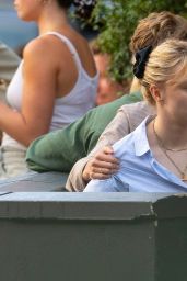 Emma Corrin Carries Luggage, Not Gossip