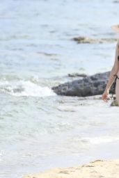 Heather Graham Unwinds in Black Bikini on Sardinian Beach