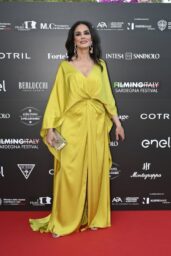 Maria Grazia Cucinotta Dazzles in Golden Glamour at Filming Italy 2025