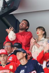 Swift Cheers Stanley Cup Final in Area Track Suit
