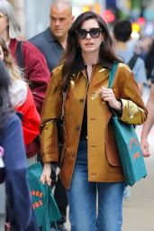 Anne Hathaway Bookshops in Gold Lamé and Flared Denim NYC