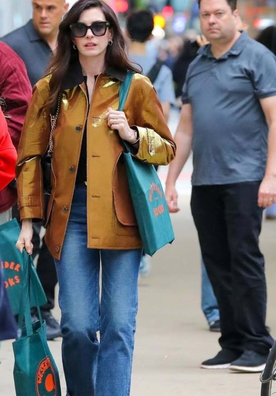 Anne Hathaway Bookshops in Gold Lamé and Flared Denim NYC