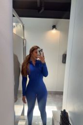 Catherine Paiz Embraces Power Pose in Blue Bodysuit
