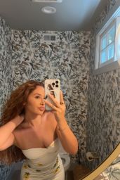 Catherine Paiz Embraces Power Pose in Blue Bodysuit