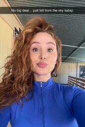 Catherine Paiz Embraces Power Pose in Blue Bodysuit