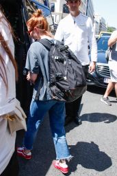 Emma Roberts Exits Parisian Hotel with Vintage Edge