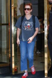 Emma Roberts Exits Parisian Hotel with Vintage Edge