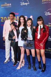 Faith Hedley Attends ‘Zombies 4’ Premiere in Red Leather Prep at El Capitan