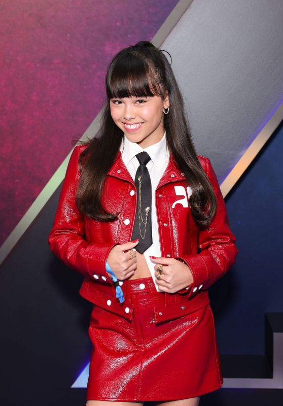 Faith Hedley Attends ‘Zombies 4’ Premiere in Red Leather Prep at El Capitan