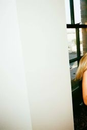 Madelyn Cline walks hallway noir in blush gown – July 2025 shoot
