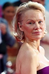 Pamela Anderson Attends Naked Gun Premiere in Regal Rodarte – London, 2025