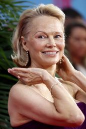 Pamela Anderson Attends Naked Gun Premiere in Regal Rodarte – London, 2025