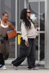 Rihanna Lands in L.A. with Somber Floral Statement