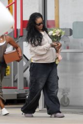Rihanna Lands in L.A. with Somber Floral Statement