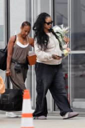 Rihanna Lands in L.A. with Somber Floral Statement