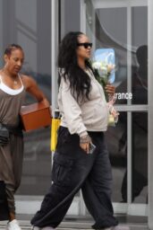 Rihanna Lands in L A with Somber Floral Statement