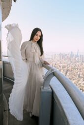 Sofia Carson Ascends Empire State in Ethereal Pleats