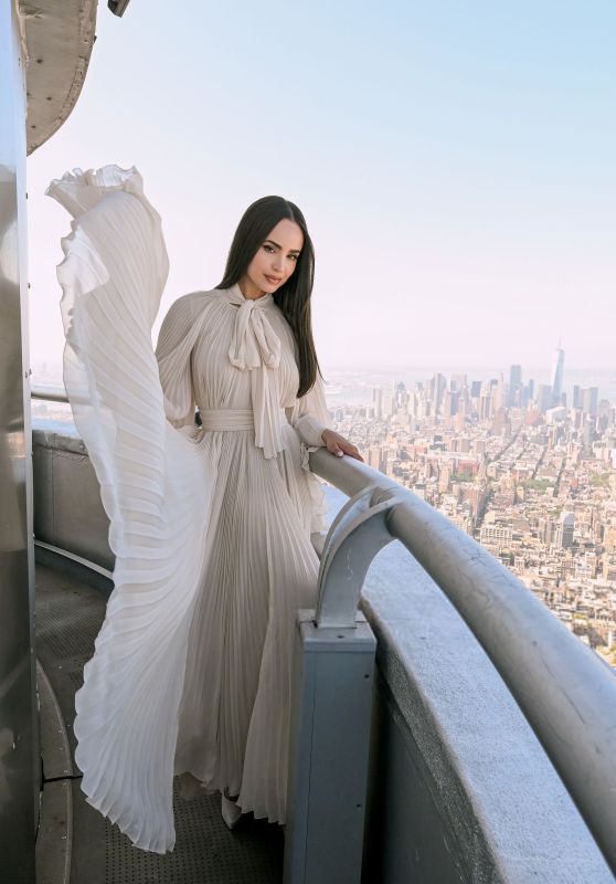 Sofia Carson Ascends Empire State in Ethereal Pleats