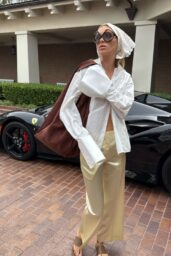 Elsa Hosk 2025 Style: White Shirt, Satin Pants, Prada Sunglasses, Suede Bag