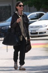 Lily Collins Debuts Neo-Gothic Airport Style in Venice