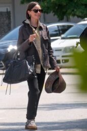 Lily Collins Debuts Neo-Gothic Airport Style in Venice
