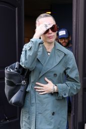 Miley Cyrus Exits Paris Hotel, Debuts Avant-Garde Trench