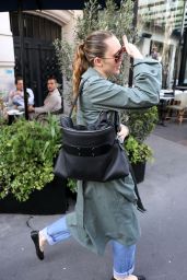 Miley Cyrus Exits Paris Hotel, Debuts Avant-Garde Trench