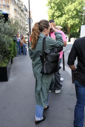 Miley Cyrus Exits Paris Hotel, Debuts Avant-Garde Trench
