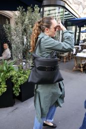 Miley Cyrus Exits Paris Hotel, Debuts Avant-Garde Trench