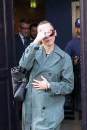Miley Cyrus Exits Paris Hotel, Debuts Avant-Garde Trench