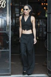 The Rebellious Pinstripe: Zoë Kravitz Channels Parisian Chic with a Punk Twist