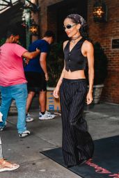 The Rebellious Pinstripe: Zoë Kravitz Channels Parisian Chic with a Punk Twist