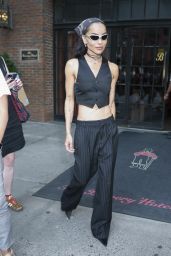 The Rebellious Pinstripe: Zoë Kravitz Channels Parisian Chic with a Punk Twist