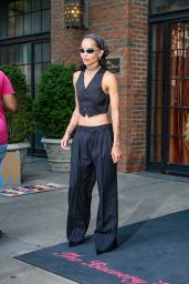 The Rebellious Pinstripe: Zoë Kravitz Channels Parisian Chic with a Punk Twist