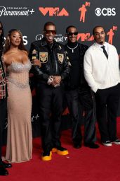 Cacie Smith and Busta Rhymes attend 2025 MTV VMAs in crest-clad contrast